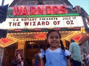 My daughter Evelyn excited to watch the Wizard of Oz on the big screen at Warnors Theater.