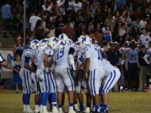 Madera in offensive huddle