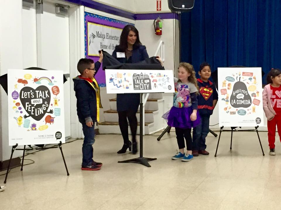 Lori Gonzalez of Fowler Unified along with students from Malaga reveal sample campaign graphics at the press event