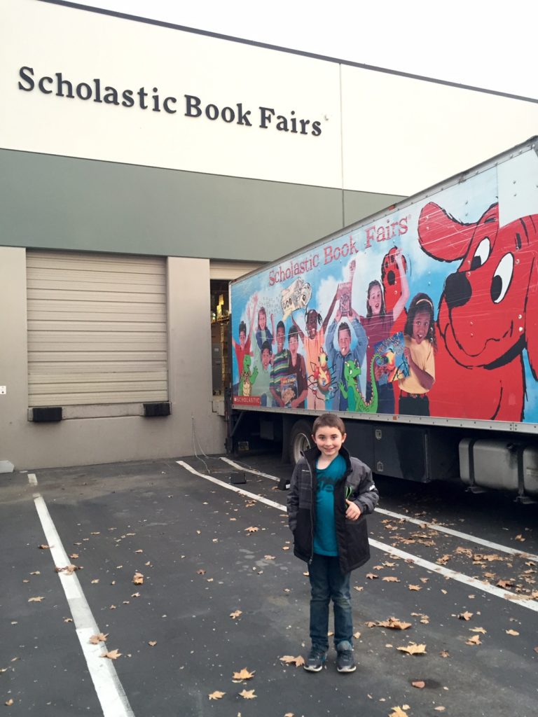 Standing in front of the Scholastic Warehouse Sale!