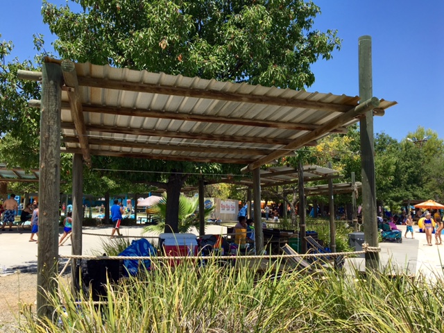 Shaded picnic areas surrounding Ohana Bay