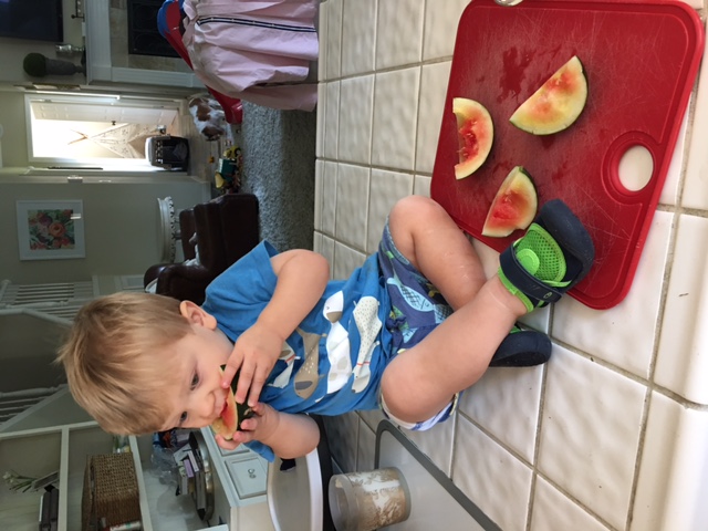 Clark eating sugar baby watermelon