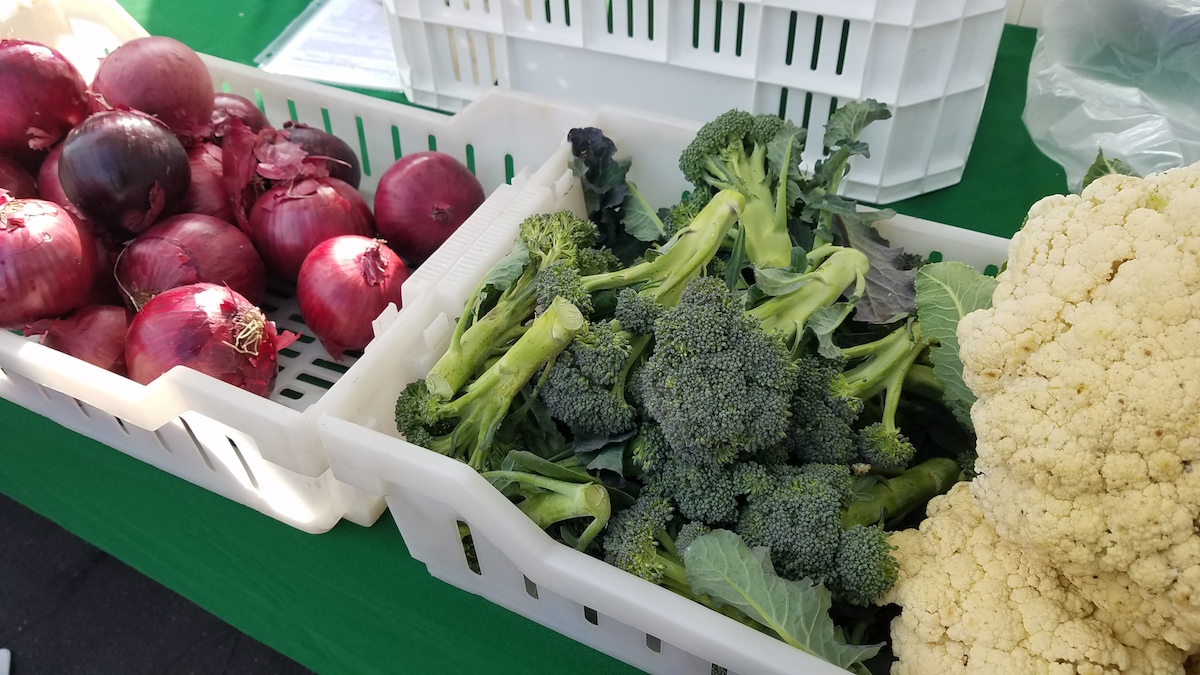 broccoli and onions for sale at a Farmers Market in Clovis