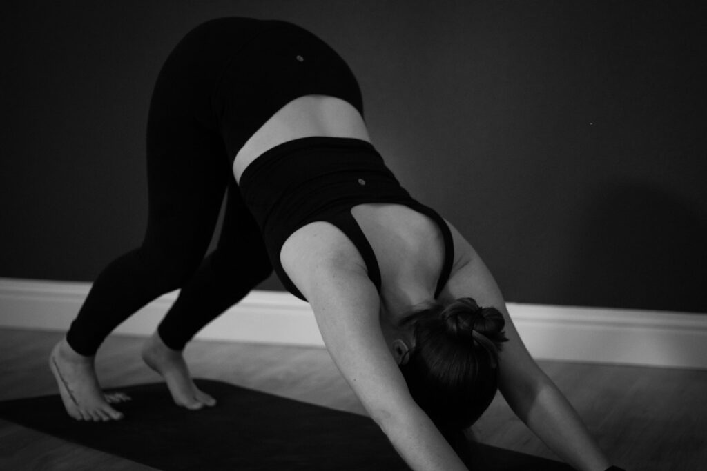 Downward dog at Wellness by Muses