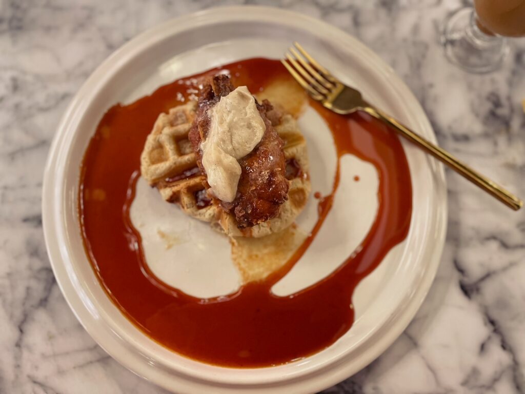 Chicken and Belgian Waffle with Maple Bourbon Gochujang syrup at The Brunch Bar in Clovis