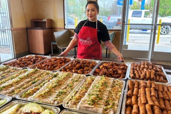 Malee Vang, owner of Malee's Kitchen, shown with trays and trays of her amazing Hmong street-style cuisine (my organization and our guests were the lucky recipients of this order!)