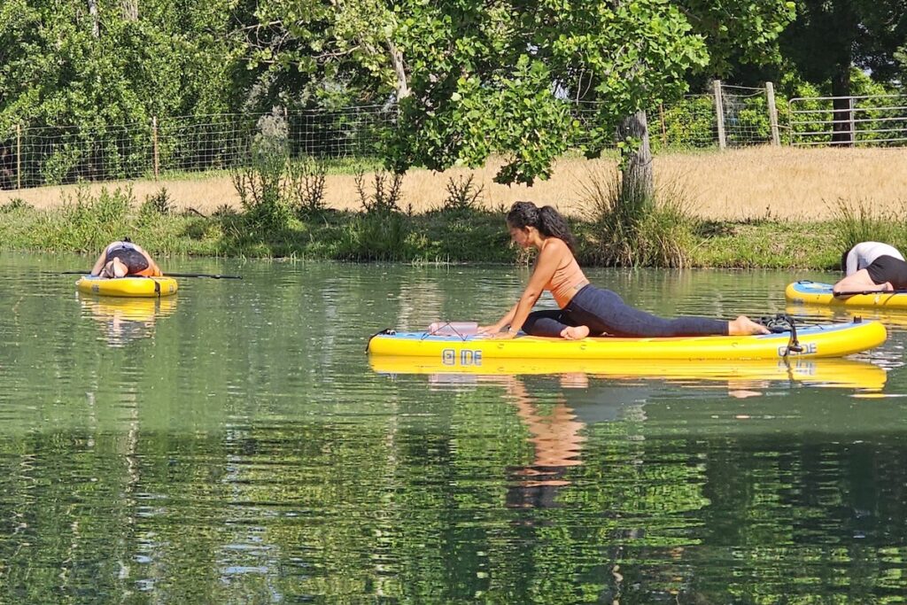 Yoga Pose on the water with Golden Light Paddle