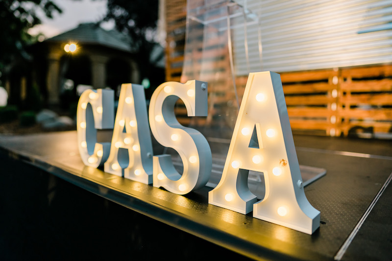 a lit sign for CASA of Fresno